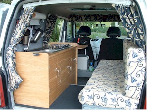 View of the campervan conversion from the back showing the seating - click for the full size image (opens in a new window)